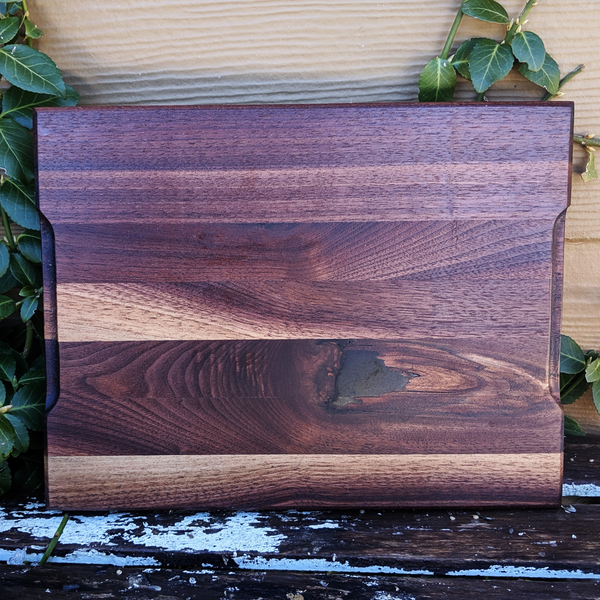 Detail shot of beveled edge craftsmanship on walnut board