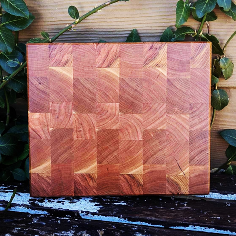 Front view of small cherry end grain cutting board with rich wood grain