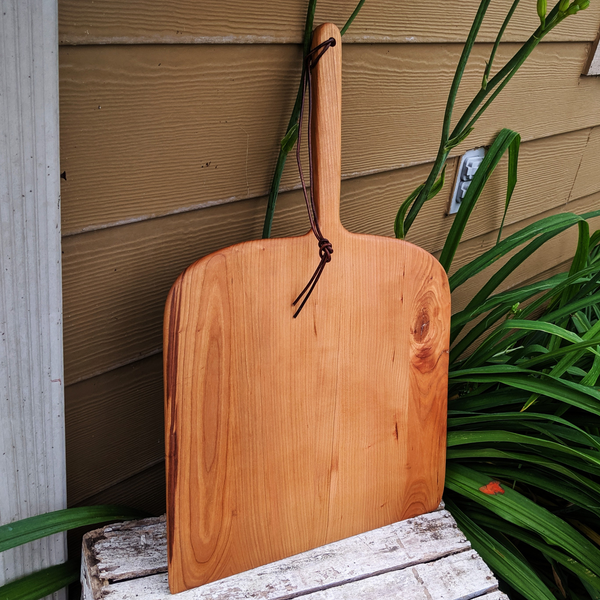 Front view of Cherry Wood Pizza Rocker with ergonomic grip