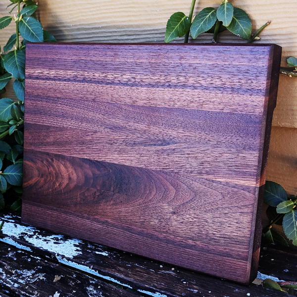 Top-down view of black walnut edge grain board showcasing wood grain