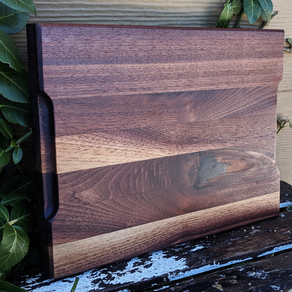 Handcrafted black walnut board showing rich wood grain