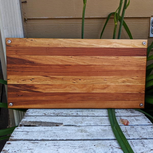 Edge view showing thickness and craftsmanship of spalted cherry wood serving board