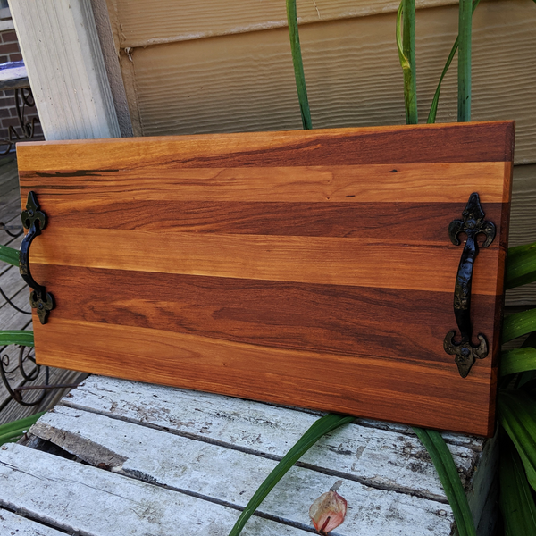 Side profile of spalted cherry wood serving tray showing handle and beveled edge