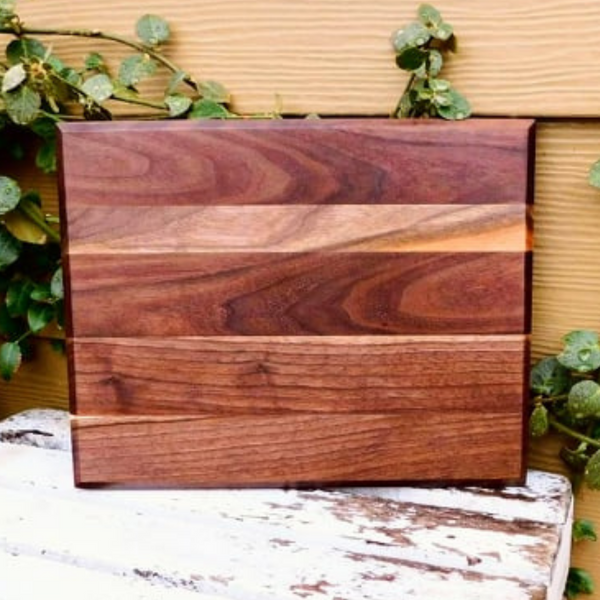 Black Walnut edge grain cutting board with beveled edge.