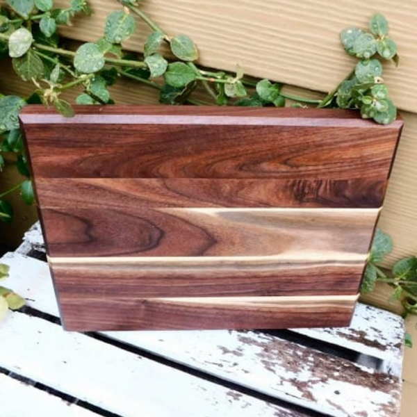 Black Walnut edge grain cutting board with beveled edge.