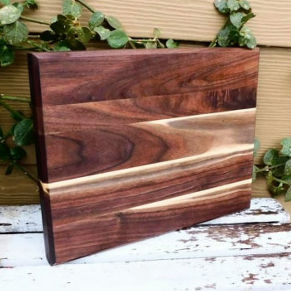 Black Walnut edge grain cutting board with beveled edge.