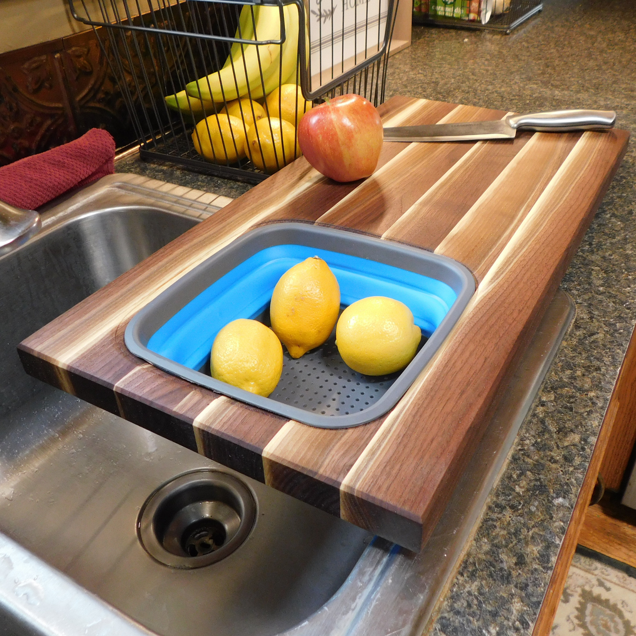 Large Over The Sink Black Walnut Edge Grain Cutting Board with Colander and Clear Rubber Grip Feet