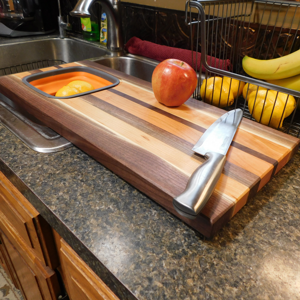 Large Over The Sink Black Walnut & Cherry Wood Edge Grain Cutting Board with Colander and Clear Rubber Grip Feet