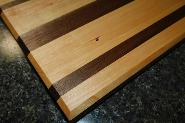 Black Walnut and Cherry Wood edge grain cutting board. Handmade in the USA by Springhill Millworks.