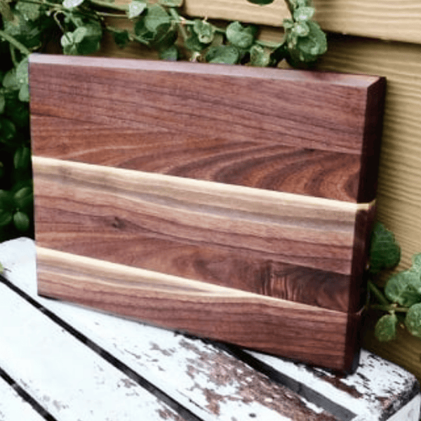 Edge grain Walnut cutting board, finished in a food grade oil and beeswax mixture. Handmade in the USA by Springhill Millworks.