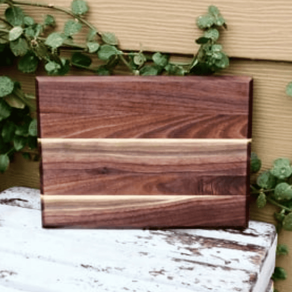 Edge grain Walnut cutting board, finished in a food grade oil and beeswax mixture. Handmade in the USA by Springhill Millworks.