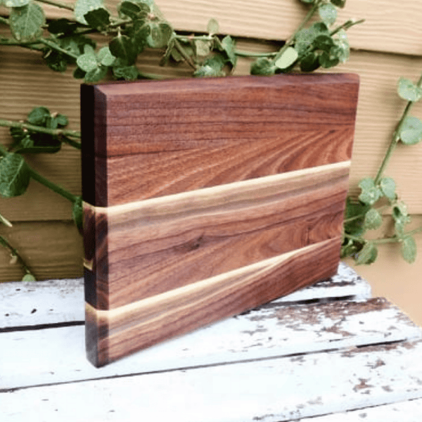 Edge grain Walnut cutting board, finished in a food grade oil and beeswax mixture. Handmade in the USA by Springhill Millworks.