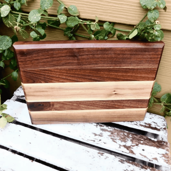 Edge grain Walnut cutting board, finished in a food grade oil and beeswax mixture. Handmade in the USA by Springhill Millworks.