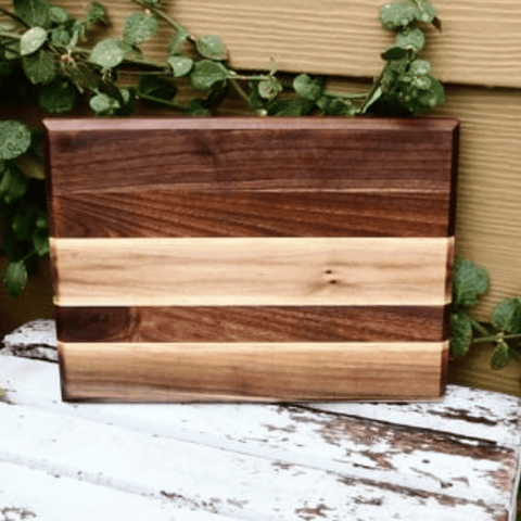 Edge grain Walnut cutting board, finished in a food grade oil and beeswax mixture. Handmade in the USA by Springhill Millworks.