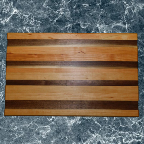 Black Walnut and Cherry Wood edge grain cutting board. Handmade in the USA by Springhill Millworks.
