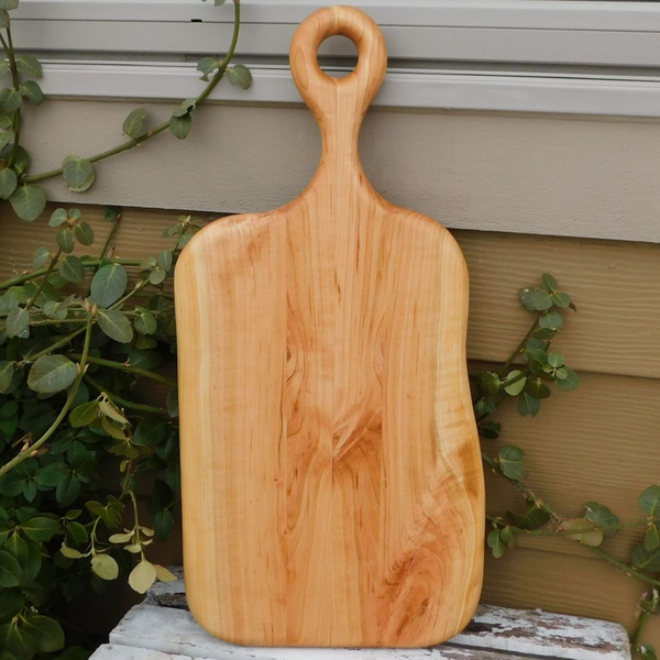 Wooden charcuterie board paddle with handle.