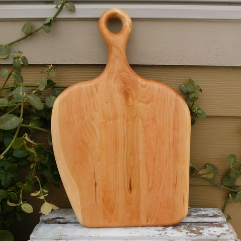 Cherry Wood charcuterie board with handle. Handmade in the USA by Springhill Millworks.