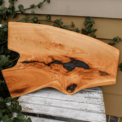 Cherry Wood charcuterie board, finished in a food grade oil and beeswax mixture. Handmade in the USA by Springhill Millworks.