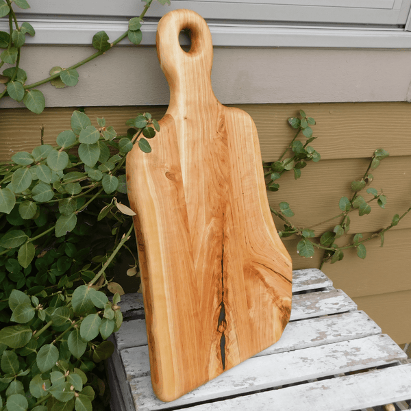 Cherry Wood charcuterie board with handle.