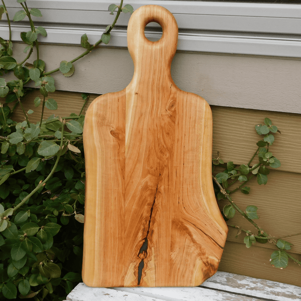 Cherry Wood charcuterie board with handle.