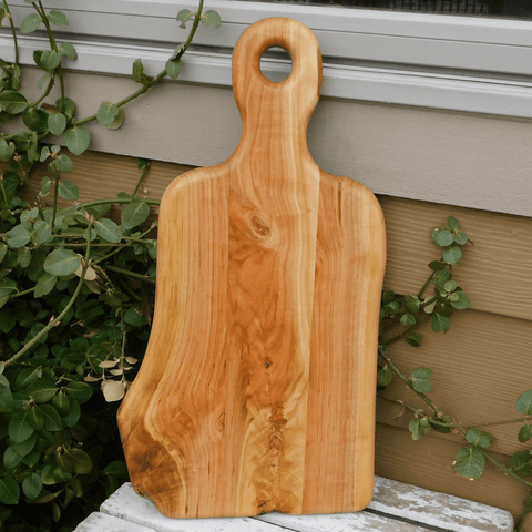 Cherry Wood charcuterie board with handle.