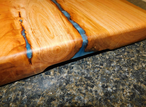 Cherry Wood live edge charcuterie river board. Handcrafted in the USA by Springhill Millworks.