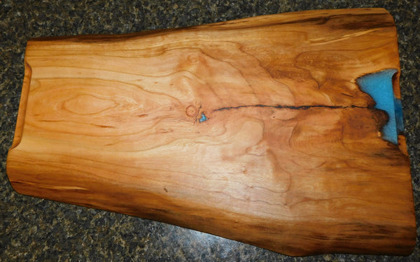 Cherry Wood live edge charcuterie river board. Handcrafted in the USA by Springhill Millworks.