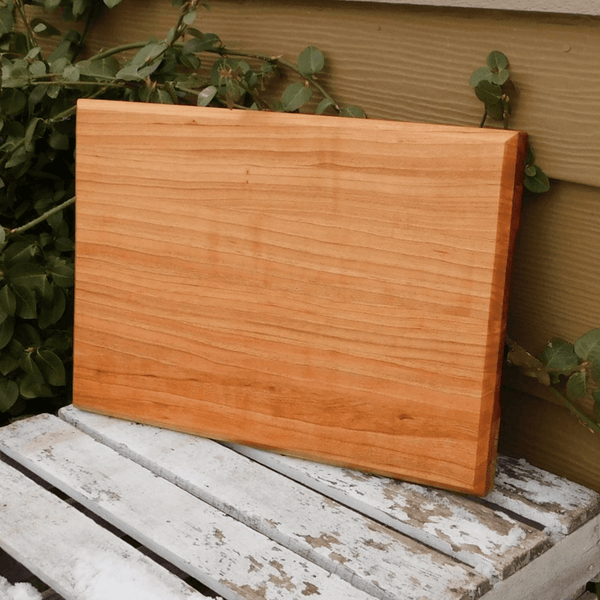 Cherry Wood edge grain cutting board with hand grooves on sides. Handmade in the USA by Springhill Millworks.