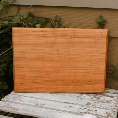 Cherry Wood edge grain cutting board with hand grooves on sides. Handmade in the USA by Springhill Millworks.