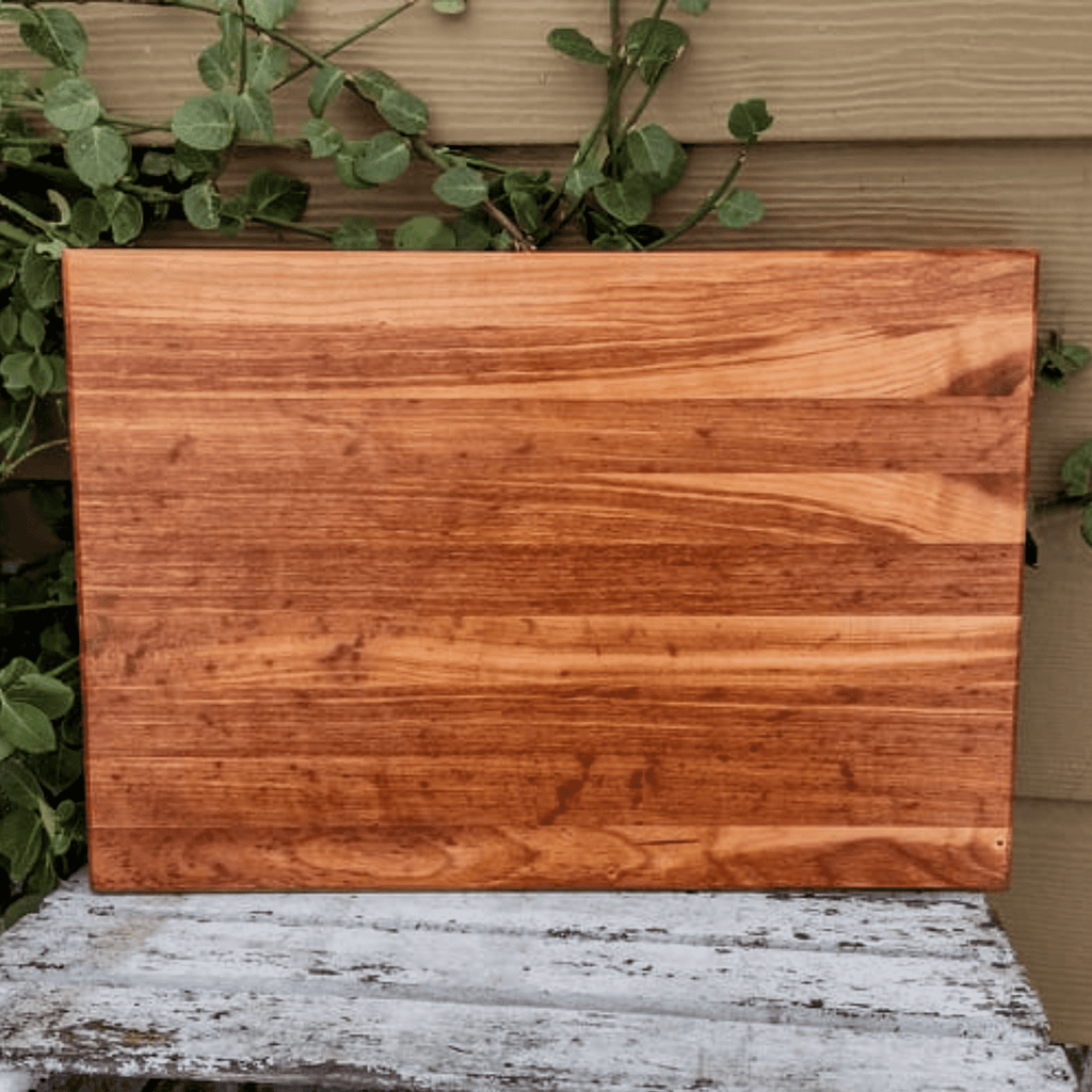 https://springhillmillworks.com/cdn/shop/products/CherryWoodEdgeGrainCuttingBoardWithHandGrooves_c082e86f-f1ff-4063-8156-76fb30aeddab_1024x1024.png?v=1646412635