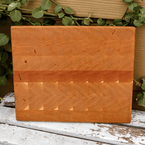 Cherry Wood end grain cutting board with beveled edge.