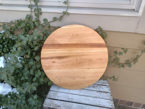 Handcrafted Cherry Wood lazy susan with clear rubber grip feet.