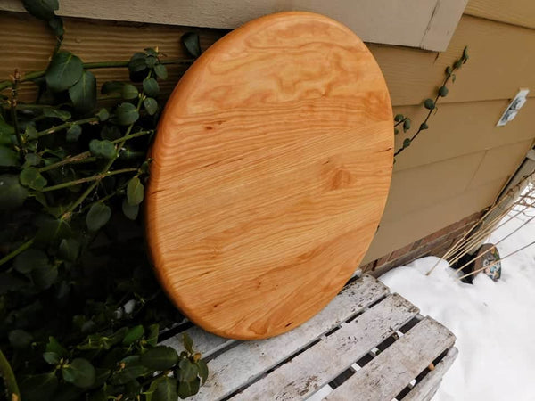 Cherry Wood circular pizza tray, finished in a food grade oil and beeswax mixture. Handmade in the USA by Springhill Millworks.