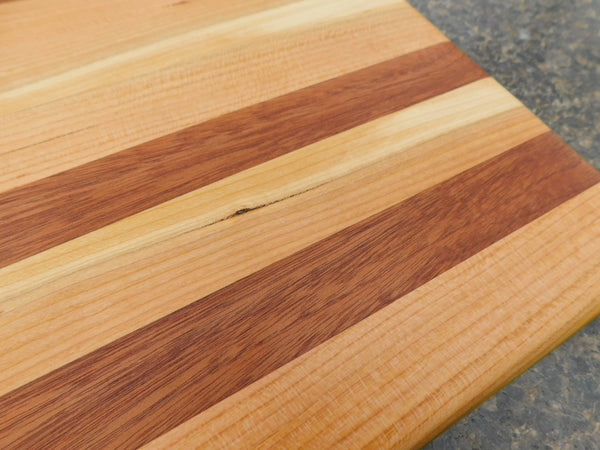 Cherry Wood & Mahogany Hardwood Edge Grain Cutting Board. Handmade in the USA using locally sourced hardwood.