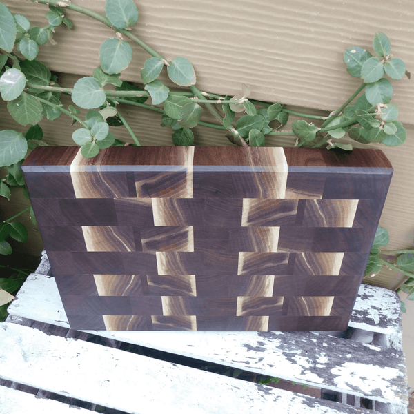 Black Walnut end grain cutting board with beveled edge, finished in a food grade oil and beeswax mixture. Handmade in the USA by Springhill Millworks.