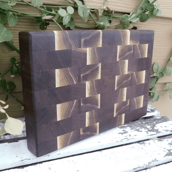 Black Walnut end grain cutting board with beveled edge, finished in a food grade oil and beeswax mixture. Handmade in the USA by Springhill Millworks.