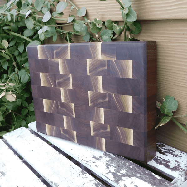 Black Walnut end grain cutting board with beveled edge, finished in a food grade oil and beeswax mixture. Handmade in the USA by Springhill Millworks.