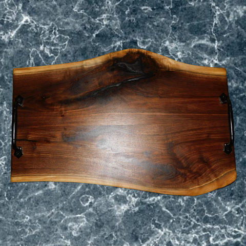 Large Black Walnut charcuterie board with cast iron handles and clear rubber grip feet. Handmade in the USA.