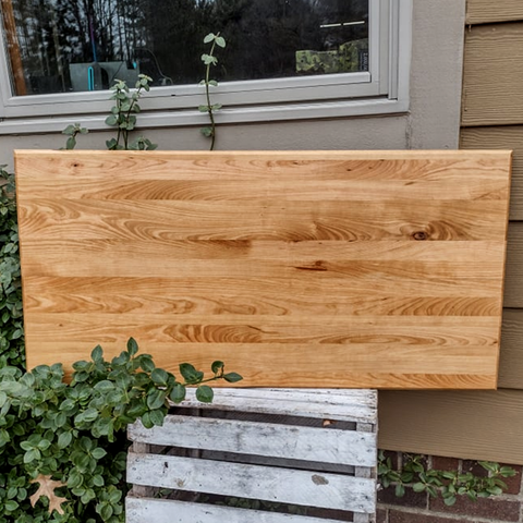 Large wooden edge grain cutting board.