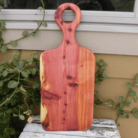 Cedar charcuterie board with handle finished in a food grade beeswax and oil mixture. Handmade in the USA by Springhill Millworks.