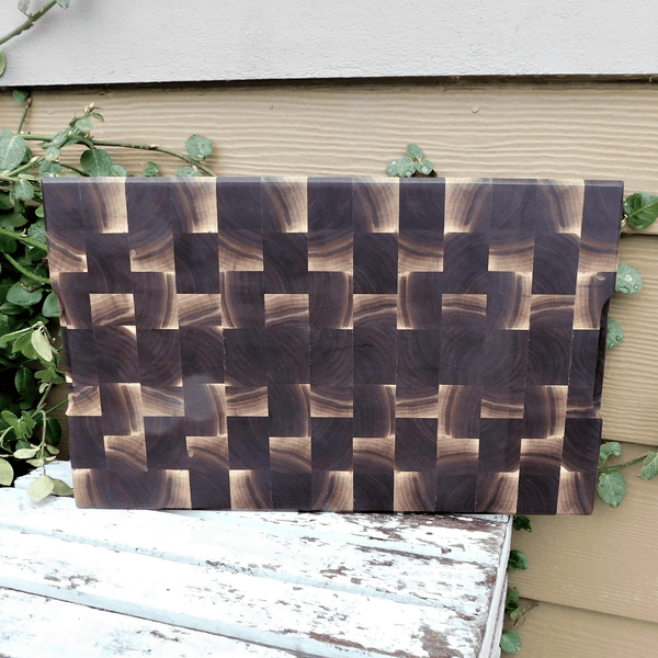 Black Walnut end grain cutting board with beveled edge, finished in a food grade oil and beeswax mixture.