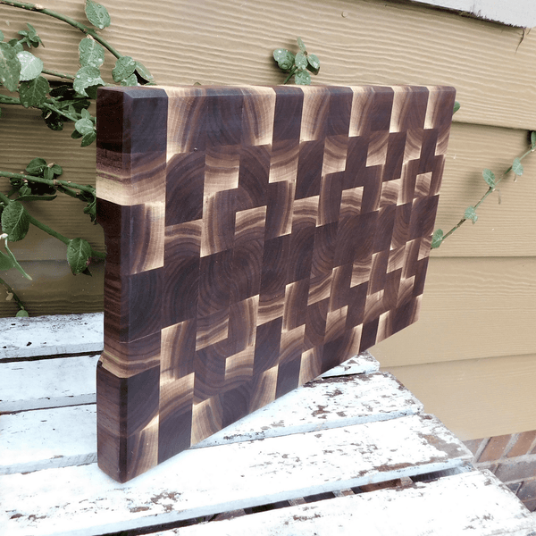 Black Walnut end grain cutting board with beveled edge, finished in a food grade oil and beeswax mixture.