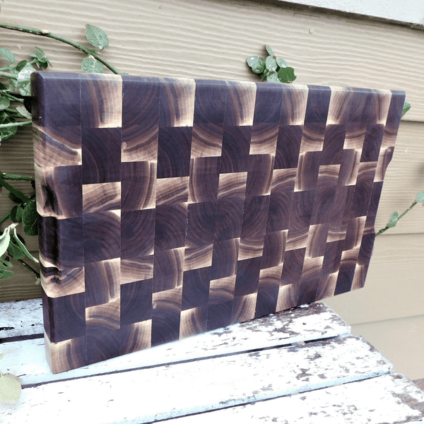 Black Walnut end grain cutting board with beveled edge, finished in a food grade oil and beeswax mixture.