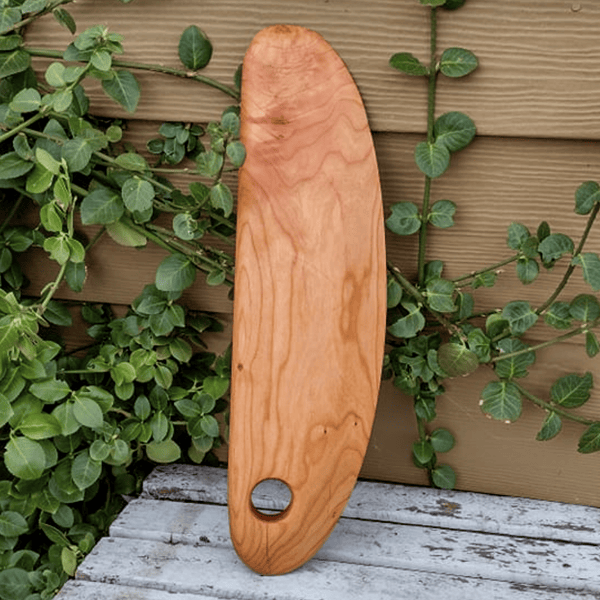 Front view of handcrafted cherry wood pizza rocker cutter knife